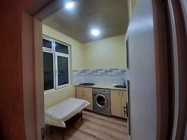 Mənzillər: 1 otaqlı mənzil – mətbəx və sanitar qovşaqla - Plan: 1 otaq, dəhliz — 9