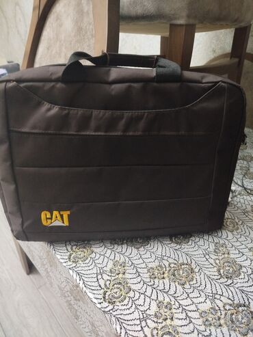 Сканеры: CAT brendinin qəhvəyi rəngli noutbuk çantası. Çanta noutbukları və