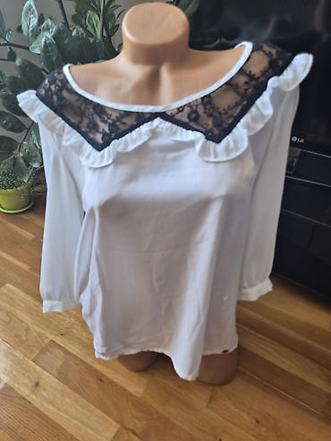 Bluze: Sedam bluzica sa neznatnim tragovima korišćenja. Zelena - M veličina — 11