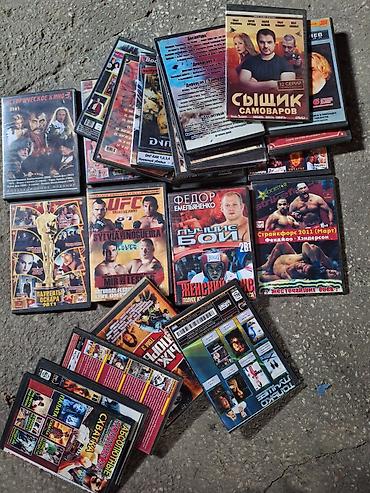 Коллекция DVD-дисков с фильмами, сериалами и боями без правил