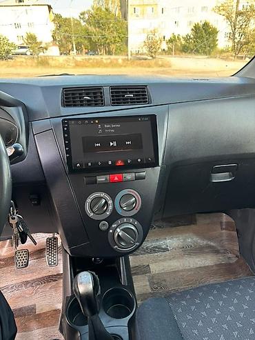 Daihatsu Cuore: 2008 г., 1 л, Механика, Бензин, Хэтчбэк — 8