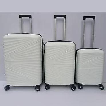 Putni koferi i torbe: === PART 1: TEXTUAL DESCRIPTION === Set od tri bela kofera sa tvrdim — 19