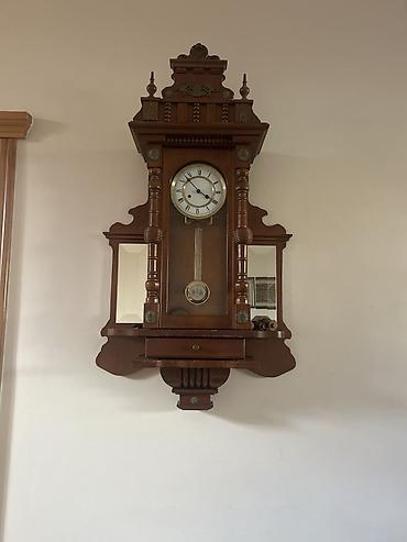 Divar saatları, Mexaniki, Mayatnik