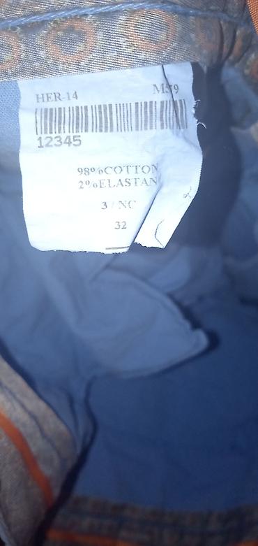 bele košulje: Hermès muške pantalone – model chino, svetloplave boje. - Brend — 3