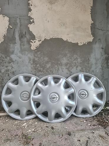 opel spoiler: Opel təkər qalpoqları (3 ədəd) - Orijinal Opel loqolu, gümüş rəng - — 1