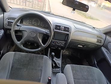 обшивка мазда: Mazda 626: 1999 г., 1.8 л, Механика, Газ, Лифтбек — 5