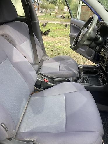 салон для машины: Nissan Almera: 2003 г., 1.5 л, Механика, Бензин, Хэтчбэк — 3