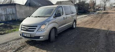 киа старекс: Минивэн Hyundai H-1 в сером цвете, предназначенный для перевозки