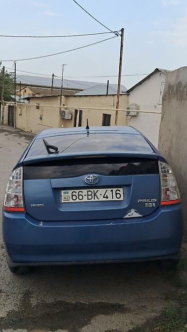 Toyota Prius (2-ci nəsil) – mavi rəngli hibrid liftbek. Texniki lalafo.az -da Toyota Prius (2-ci nəsil) – mavi rəngli hibrid liftbek. Texniki