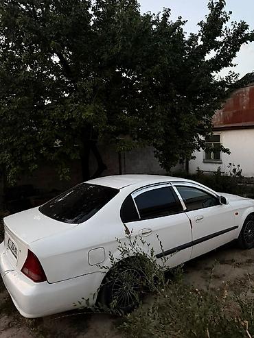 tayota progres: Белый седан 4-дверный, передний привод. Кузов: аэродинамичный обвес — 3