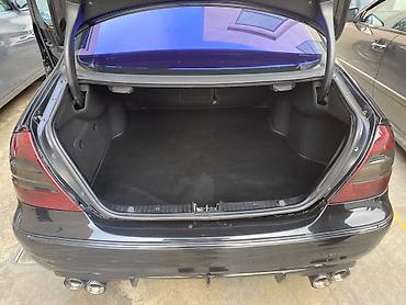 mercedes sekilleri: Mercedes-Benz E‑Class (W211) sedan – qara rəng, AMG üslublu eksteryer — 8