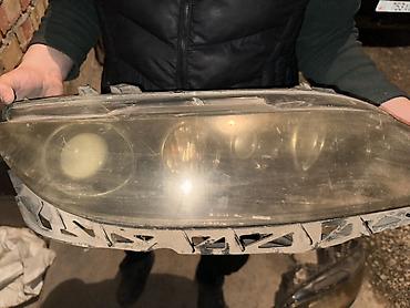 Передние фары: Передняя левая фара Mazda Оригинал — 1