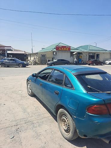 мазда 323 1994: Mazda 323: 1995 г., Хэтчбэк — 2