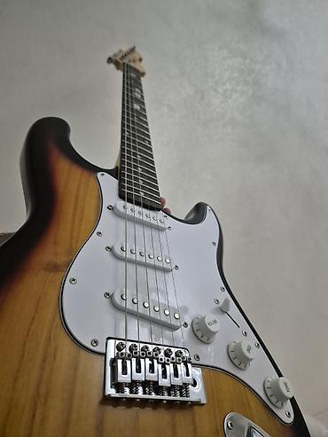 Elektrik gitara – Strat tipli korpus, sunburst rəng keçidi lalafo.az -da Elektrik gitara – Strat tipli korpus, sunburst rəng keçidi