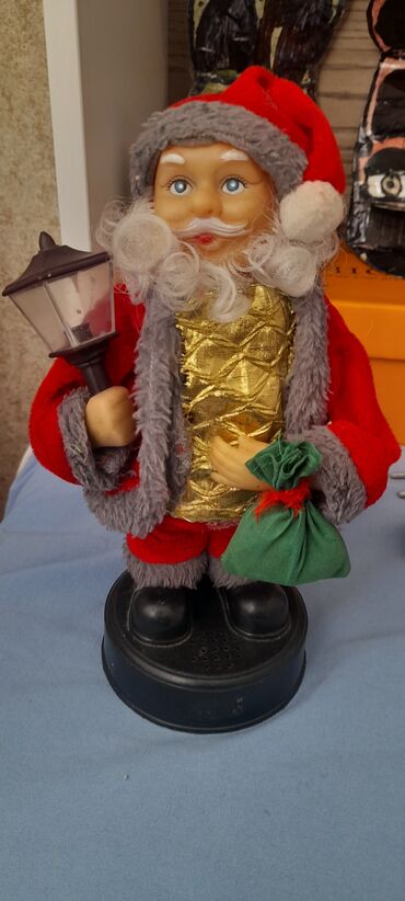 zefer bayrami sekilleri: Yeni il bəzəyi – musiqili və hərəkətli Şaxta Baba fiquru - Parlaq