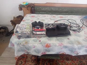 PS3 (Sony PlayStation 3): Игровая консоль Sony PlayStation 3 (модель Slim) с набором дисков — 13