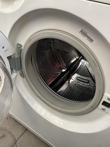 круглый: Стиральная машина Indesit с фронтальной загрузкой. Белый корпус — 2