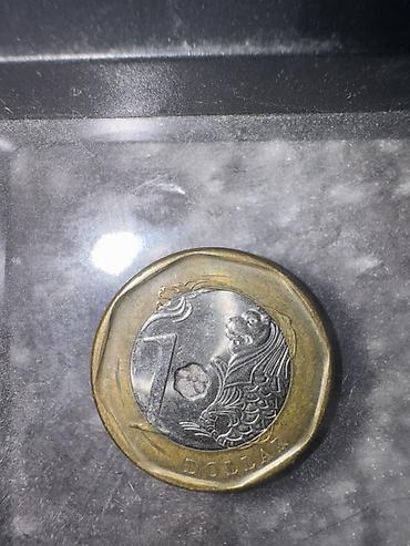 Монеты: -Лира - доллары - ОАЭ: 1 дирхам (надписи на арабском и английском — 9