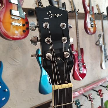 Gitaralar: Elektro-gitara Smiger L-G9 WH Simlərin sayı: 6 Üst: Ağcaqayın Qol: Gül — 4