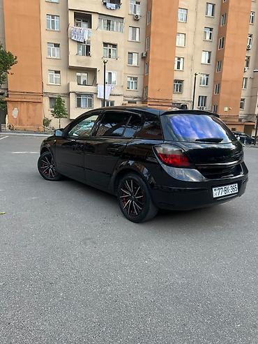 mini cooper 2009: Marka/model: Opel Astra H (hatchback, 5 qapı) Rəng: qara (parlaq) — 4