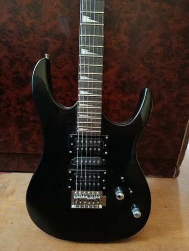 Velosiped ehtiyyat hissələri: Elektro gitara – Dlaso brendi - Korpus: iki “cutaway” dizaynlı, qara