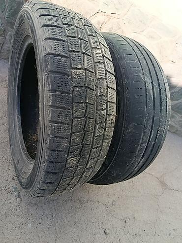 Пара автомобильных шин R16 разных типов. 1) Dunlop 205/60 R16 92Q –