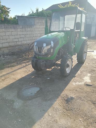 qoşqu yeri: Yaşıl rəngli mini traktor, kabinli. - Dizel mühərrik (suyutmalı) — 1