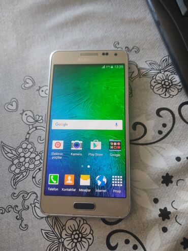 gence univermaq telefon: Samsung Galaxy Alpha, 32 ГБ, цвет - Золотой, Сенсорный