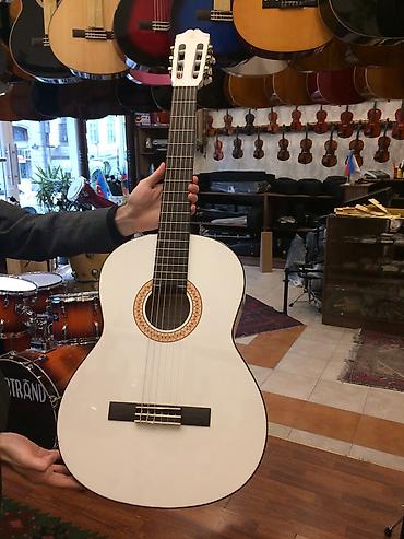 Gitaralar: Rivertone klassik gitara
canta hediyye — 1