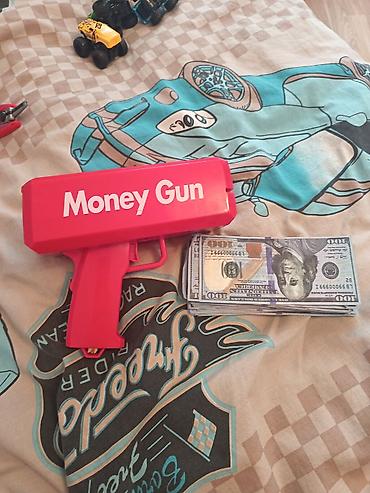 Digər oyuncaqlar: Money Gun satılır içində batereyasi ilə beraber qırıqı xarabı yoxdur — 2