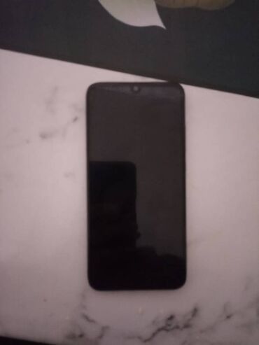 телефон fly fs521: Xiaomi Redmi 7, 32 ГБ, цвет - Черный, 
 Отпечаток пальца