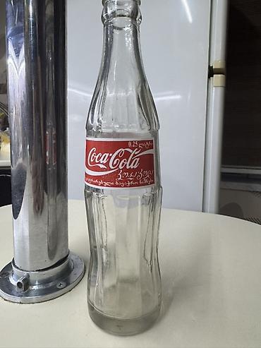 gürcü xengeli: Məhsul: Şüşə Coca‑Cola butulkası Təsvir: - Həcm: 0.25 L (etiketdə — 5