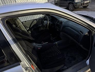 Mazda: Mazda 323: 2003 г., 1.3 л, Механика, Бензин, Универсал — 8