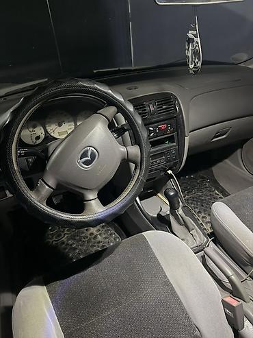 субару панель: Mazda 626: 2002 г., 2 л, Механика, Бензин, Универсал — 4
