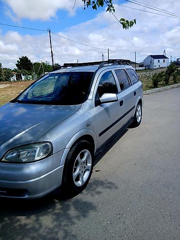 opel astra xectbek: Opel Astra Caravan (Universal) – gümüşü rəng Xüsusiyyətlər: - Kuzov — 4