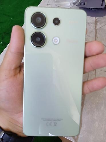 Другие мобильные телефоны: Redmi Note 13 Смартфон в мятно‑зеленом цвете с плоскими гранями и — 1