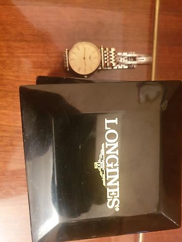 Qol saatları: Işlənmiş qızılı rəngdə vaxtı ilə 2000 evroya alınıb ) Longines — 2