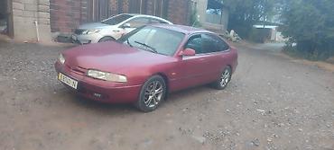 spark ltz: Mazda 626: 1996 г., 2 л, Механика, Бензин, Хэтчбэк — 3