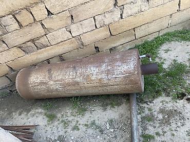 kapron borular: Metaldan hazırlanmış iri silindrik soba/katel korpusu (baca çıxışı və — 1