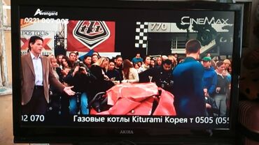 талас терек: Телевизор Akai с плоским экраном, оснащенный черным корпусом и