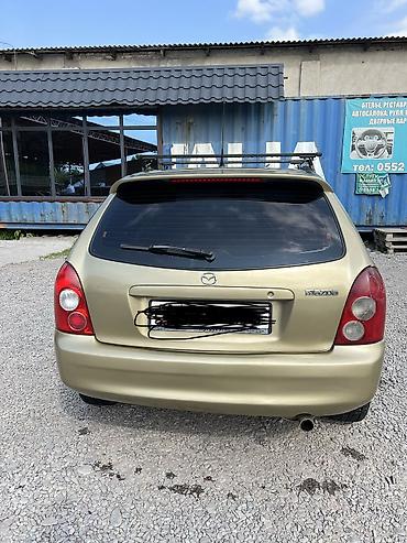 Mazda: Mazda 323: 2003 г., Бензин — 6