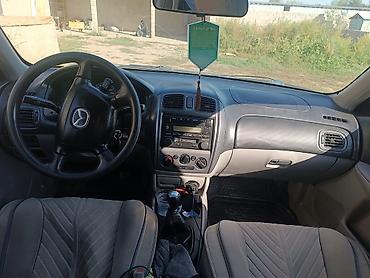 прокладка впускного коллектора: Mazda 323: 2001 г., 1.6 л, Механика, Бензин, Универсал — 5