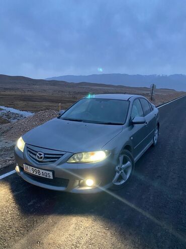 бишкек мото: Автомобиль Mazda 6 серого цвета. Этот седан оснащен задним спойлером и