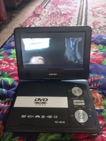 купить 8к телевизор: Портативный DVD-плеер COBY с 7-дюймовым поворотным экраном. Модель
