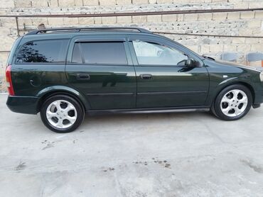 Opel: Opel Astra Caravan (universal) – tünd yaşıl rəng • Kuzov: universal — 7