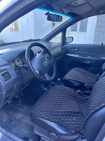 саната желтый: Mazda PREMACY: 2004 г., 1.8 л, Механика, Бензин, Универсал — 10