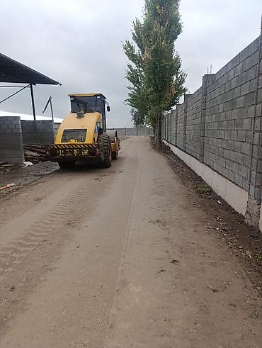 ness construction: Укладка асфальта . - Уплотнение щебня, песка, грунта, асфальта на — 1
