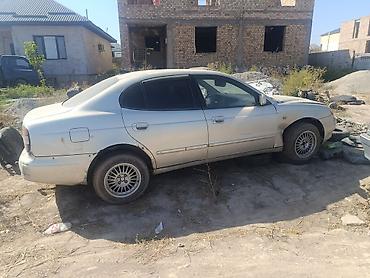 Унаа: Daewoo Leganza: 1998 г., Кол менен иштөөчү, Бензин, Седан — 4