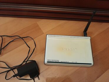 notebook modem: Mодем-роутер "Tenda" +54М Wireless ADSL2, б/у . Чтобы посмотреть все