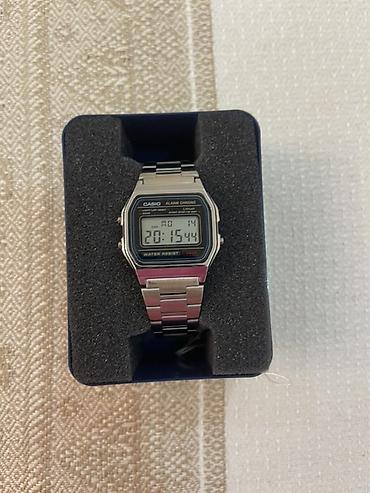 garmin forerunner 55: Оригинальные CASIO - Корпус: прямоугольный, серебристый, с надписями — 1